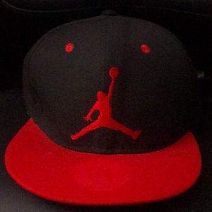 Jordan’s ( used )snap-back hat in good condition red/black